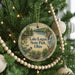 A round ornament hanging on a Christmas tree, featuring a scenic image of Lake Logan State Park, Ohio.