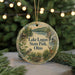 A round ornament with a scenic image of Lake Logan State Park, Ohio, featuring a bird, a deer, and a waterfall.