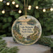 A round ornament with a scenic landscape depicting Lake Metigoshe State Park in North Dakota, surrounded by pine trees and a lake.