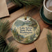 A round ornament with a scenic lake and forest landscape, featuring the text "Lake Sylvia State Park, Washington".