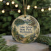 A round ornament with a scenic landscape of Lake Sylvia State Park, Washington, featuring a lake, mountains, pine trees, and flowers.