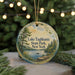 A round ornament with a scenic lake and forest landscape, featuring text that reads "Lake Taghkanic State Park, New York".