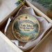 A decorative ornament in a box, featuring a scenic image of Lake Tahoe, Nevada State Park, Nevada.
