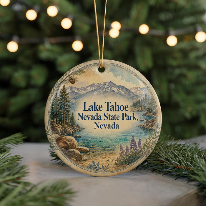 A circular ornament with a scenic landscape of Lake Tahoe, Nevada, featuring mountains, pine trees, and a lake.