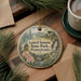 A round ornament with a scenic landscape of Laurel Summit State Park, Pennsylvania, featuring a bird, flowers, and a waterfall.