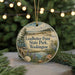 A circular ornament with a scenic landscape of Leadbetter Point State Park, Washington, featuring a bird, pine trees, and a body of water.