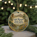 A round ornament with a scenic landscape of Little Missouri State Park, North Dakota, featuring a cabin, mountains, and a river.
