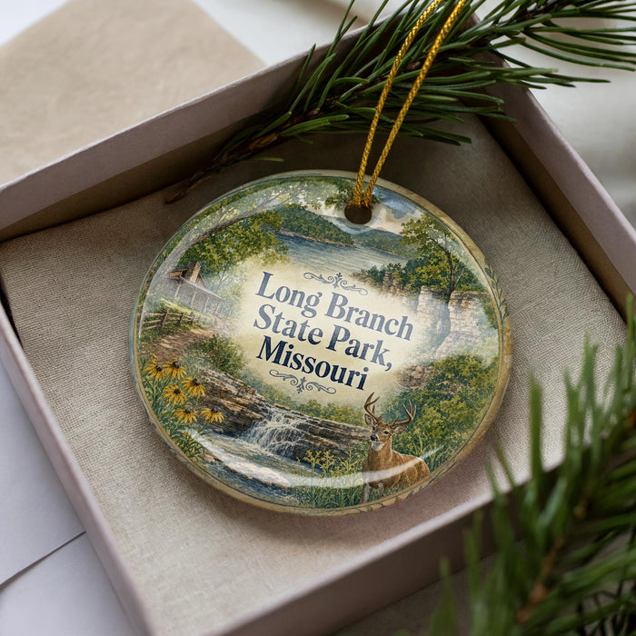 A decorative ornament in a box, featuring a scenic image of Long Branch State Park in Missouri.