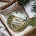 A decorative ornament with a scenic landscape of a waterfall, mountains, and a person kayaking in the Missouri State Recreation Area, Nebraska.