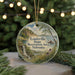 A round ornament with a scenic landscape of a lake, waterfall, and mountains, along with text that reads "Louisville State Recreation Area, Nebraska".