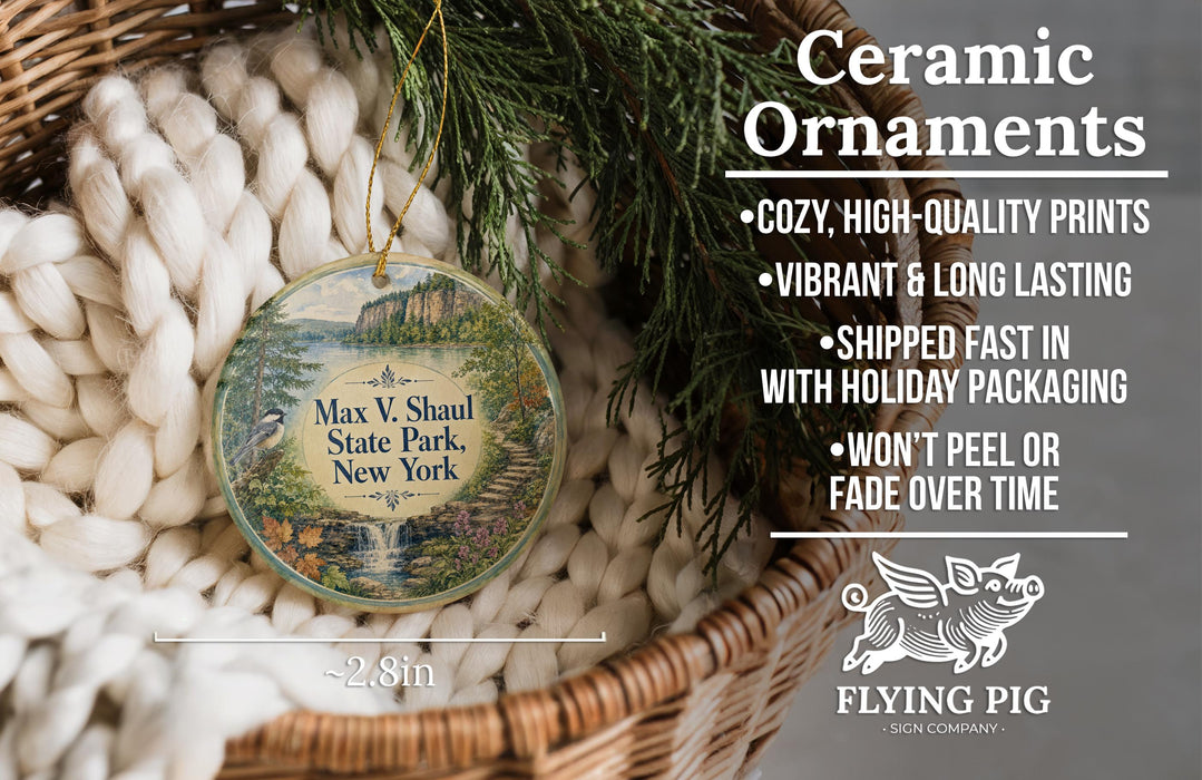 Ceramic ornaments, featuring a scenic image of Max V. Shaul State Park, New York, hanging from a wicker basket.