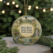 A round ornament with a scenic image of the Mayo River State Park in North Carolina, featuring a bird, a waterfall, and a bridge.