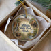 A round ornament with a scenic image of Millsite State Park, Utah, displayed in a box.