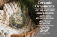 Ceramic ornaments, including a round ornament with a scenic image of Mohawk Park, Oklahoma, hanging from a wicker basket.