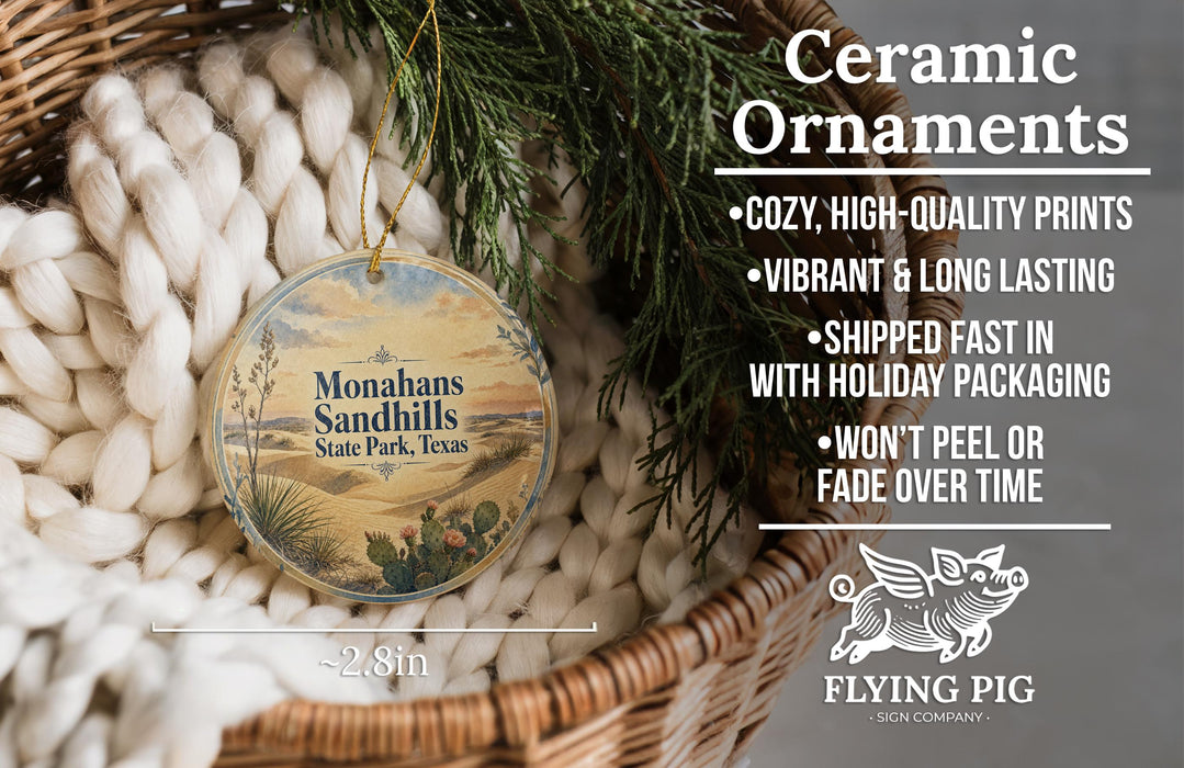 Ceramic ornaments, featuring a round ornament with a desert landscape and cactus design, hanging from a wicker basket.
