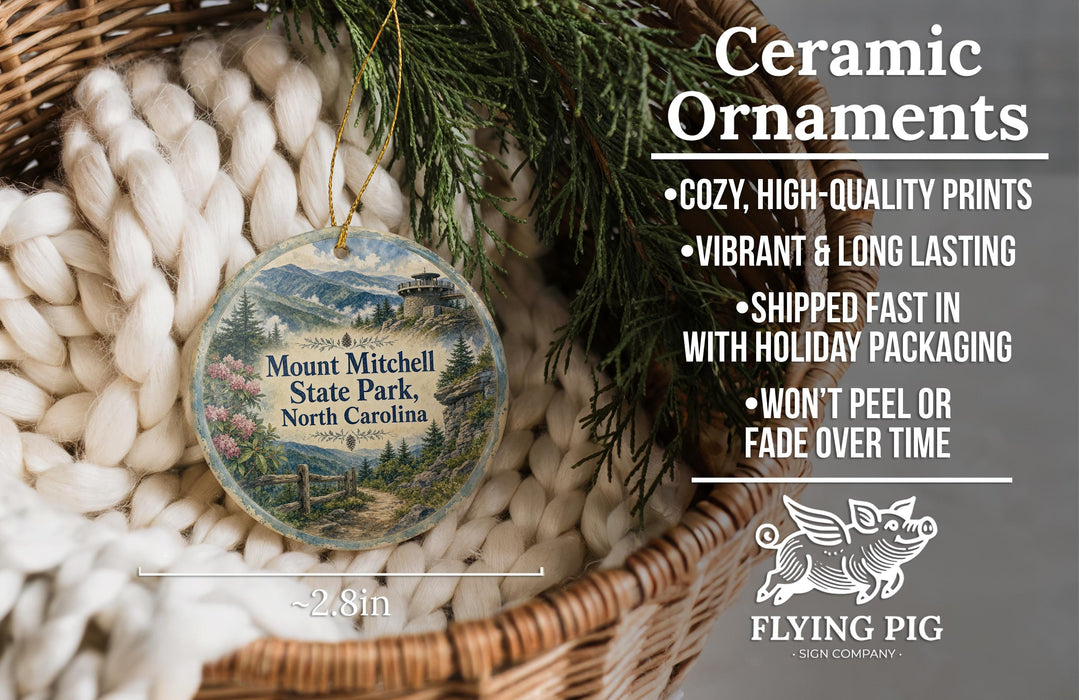 Ceramic ornaments, featuring a scenic image of Mount Mitchell State Park, North Carolina, hanging from a wicker basket.