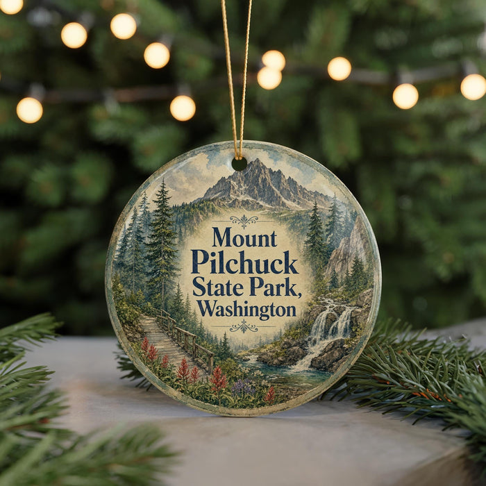 A round ornament with a scenic mountain landscape and a waterfall, featuring the text "Mount Pilchuck State Park, Washington".