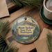 A decorative ornament featuring a scenic landscape of Mount Spokane State Park, Washington, with pine trees, a lake, and mountains in the background.