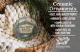 Ceramic ornaments, featuring a painting of Mount Spokane State Park in Washington, are displayed in a basket with pine branches.