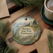 A decorative ornament featuring a serene landscape of Mukilteo State Park in Washington, with a bird, mountains, and a lighthouse in the background.