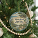 A round ornament hanging on a Christmas tree, featuring a scenic image of Myrtle Beach State Park in South Carolina.