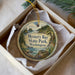 A round ornament with a scenic landscape of Mystery Bay State Park, Washington, displayed in a box with a gold string.