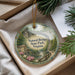 A decorative ornament with a scenic image of the Natural Bridge in Virginia, featuring a river, bridge, and surrounding greenery.