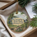 A decorative ornament with a scenic image of Neshaminy State Park, Pennsylvania, hanging from a string.