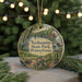 A round ornament featuring a scenic landscape of Neshaminy State Park, Pennsylvania, with a bird, a bridge, and a waterfall.