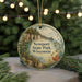 A round ornament with a scenic image of Newport State Park, Wisconsin, hanging from a string.