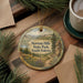 A decorative ornament featuring a scenic landscape of Newton Hills State Park, South Dakota, with a path leading through the grassy area and mountains in the background.