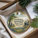 A decorative ornament with a scenic landscape of Newtown Battlefield State Park, New York, featuring a cannon, trees, and a monument.