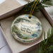 A decorative ornament featuring a scenic image of Niagara Falls, New York, with the text " Niagara Falls State Park, New York" prominently displayed.