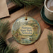 A decorative ornament featuring a scenic landscape of Niobrara State Park, Nebraska, with a small boat and pine trees in the foreground.