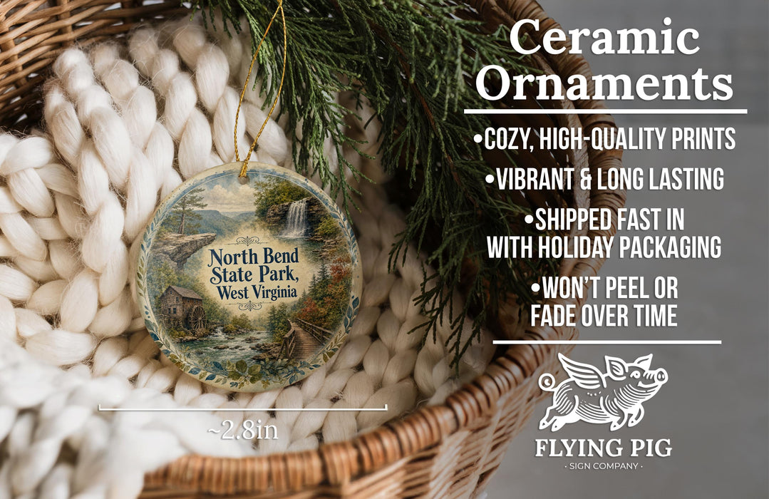 Ceramic ornaments, featuring a scenic image of the North Bend State Park in West Virginia, are displayed in a woven basket.