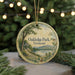 A round ornament with a scenic landscape of Oakledge Park, Vermont, featuring a gazebo, a lake, and mountains in the background.
