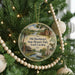 A round ornament hanging on a Christmas tree, featuring a scenic image of Old Dorchester State Historic Park, South Carolina.