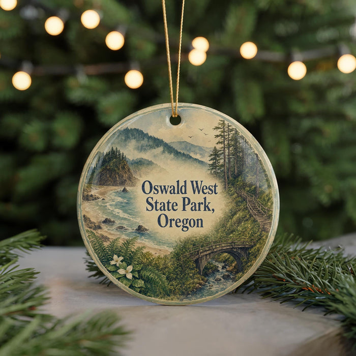 A round ornament with a scenic landscape of Oswald West State Park, Oregon, featuring a bridge, mountains, and a river.