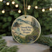 A round ornament with a scenic landscape of Oswald West State Park, Oregon, featuring a bridge, mountains, and a river.