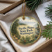 A decorative ornament with a scenic image of Pacific Pines State Park, Washington, featuring a mountain landscape, pine trees, and a bird.