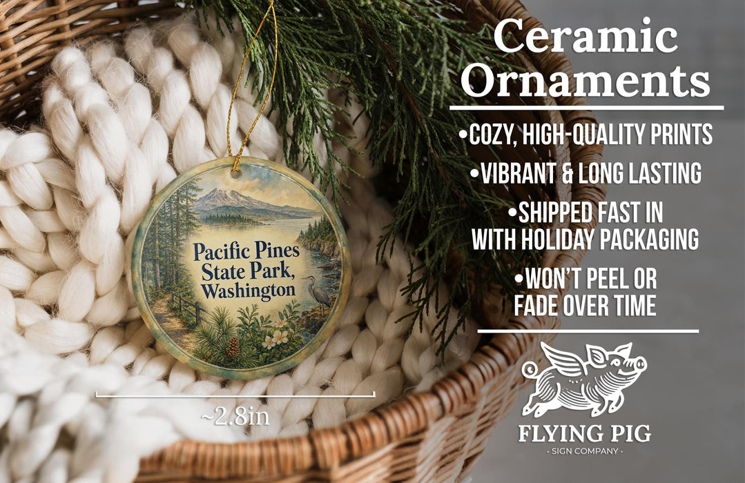 Ceramic ornaments, featuring a design of Pacific Pines State Park, Washington, with a wicker basket and pine branches in the background.