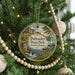 A Christmas tree ornament featuring a scenic image of Palisades State Park in South Dakota.