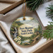 A decorative ornament with a scenic landscape of Paris Mountain State Park, South Carolina, featuring a waterfall, pine trees, and a cabin.