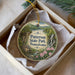 A decorative ornament in a box, featuring a scenic image of Paterson State Park, Pennsylvania.