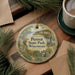 A decorative ornament featuring a scenic landscape of Perrot State Park, Wisconsin, with a lighthouse in the background.
