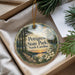 A decorative ornament with a scenic image of Petigrew State Park, North Carolina, hanging from a string.