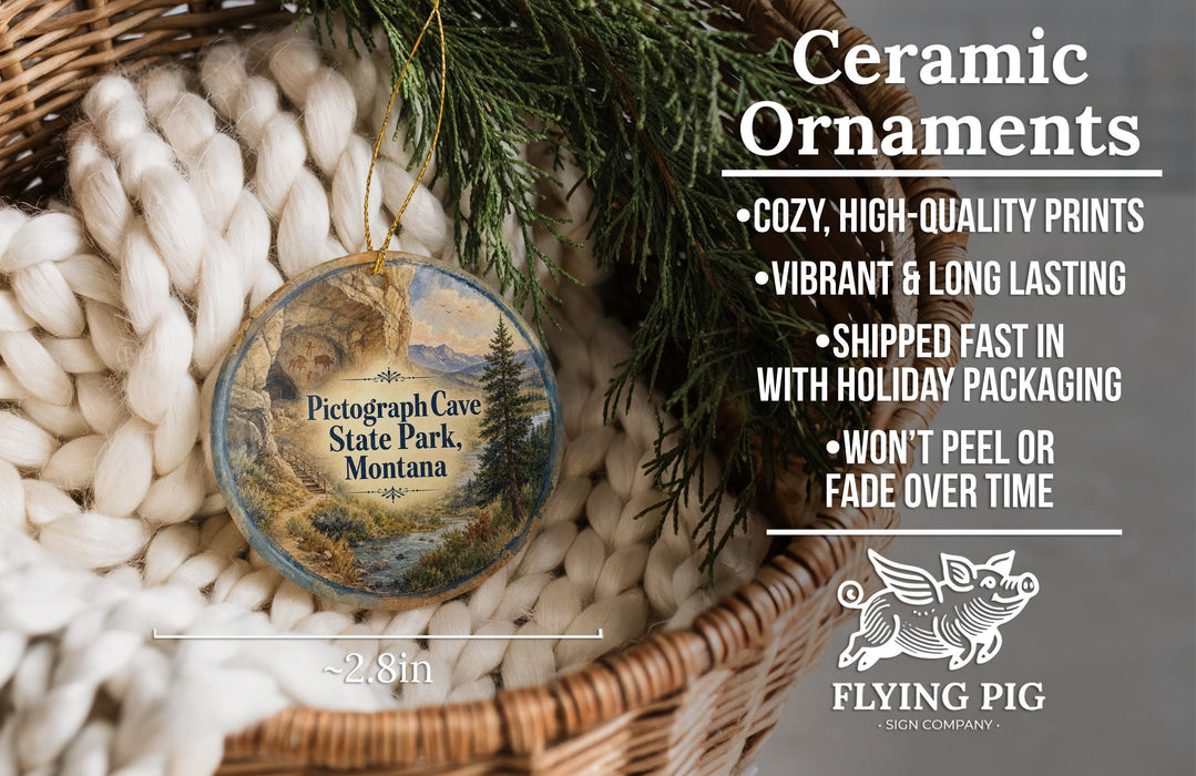 Ceramic ornaments, featuring a picture of a scenic landscape, are displayed in a basket with pine branches. The text highlights the ornaments as "Ceramic Ornaments" and mentions their features such as "Cozy, high-quality prints", "Vibrant & long lasting", "Shipped fast in with holiday packaging", and " Won't peel or fade over time".