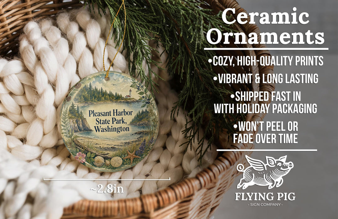 Ceramic ornaments, including a round ornament with a scenic image of Pleasant Harbor State Park, Washington, hanging from a wicker basket.