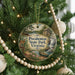 A round ornament hanging on a Christmas tree, featuring a scenic image of the Pocahontas State Park in Virginia.