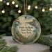 A round ornament with a scenic landscape of Pointau roche State Park, New York, featuring a body of water, trees, and a bridge.